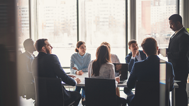 Group of men and women in a business meeting